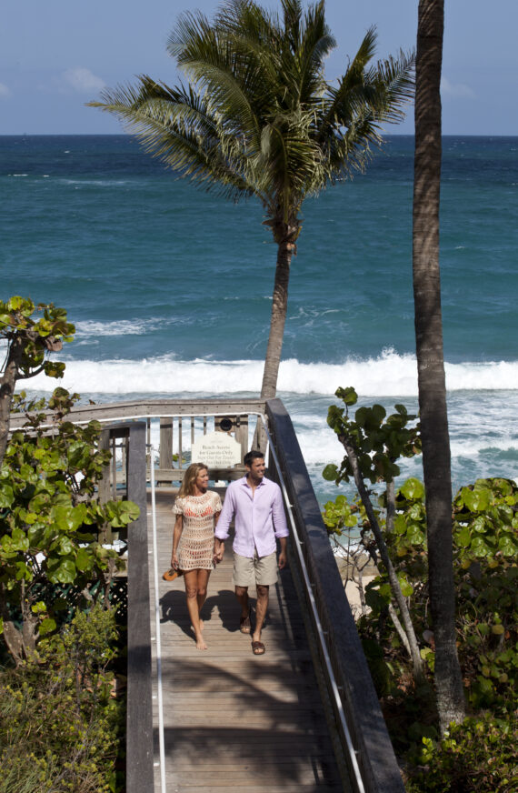 couple walking down to the beach