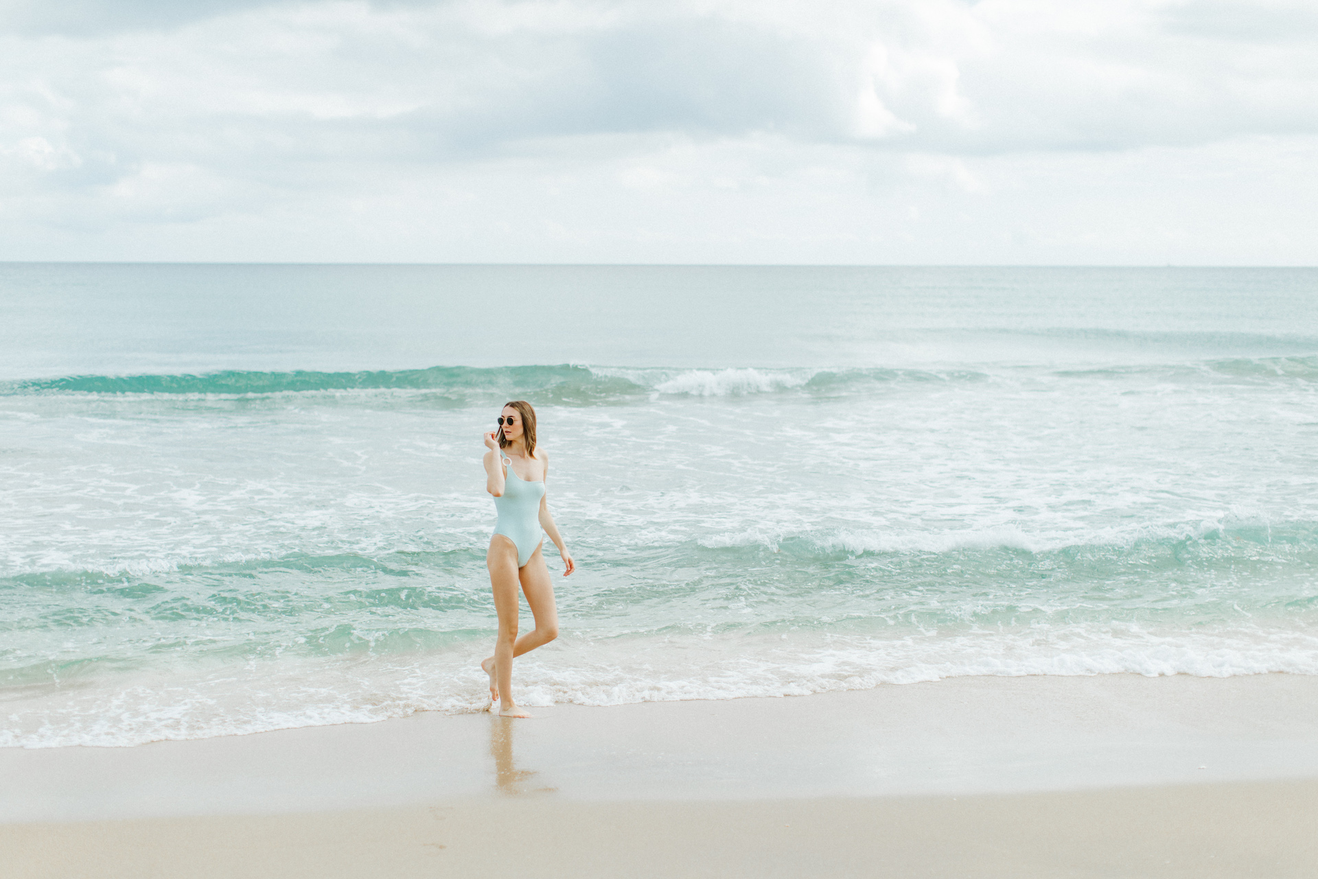 woman walking on delray beach