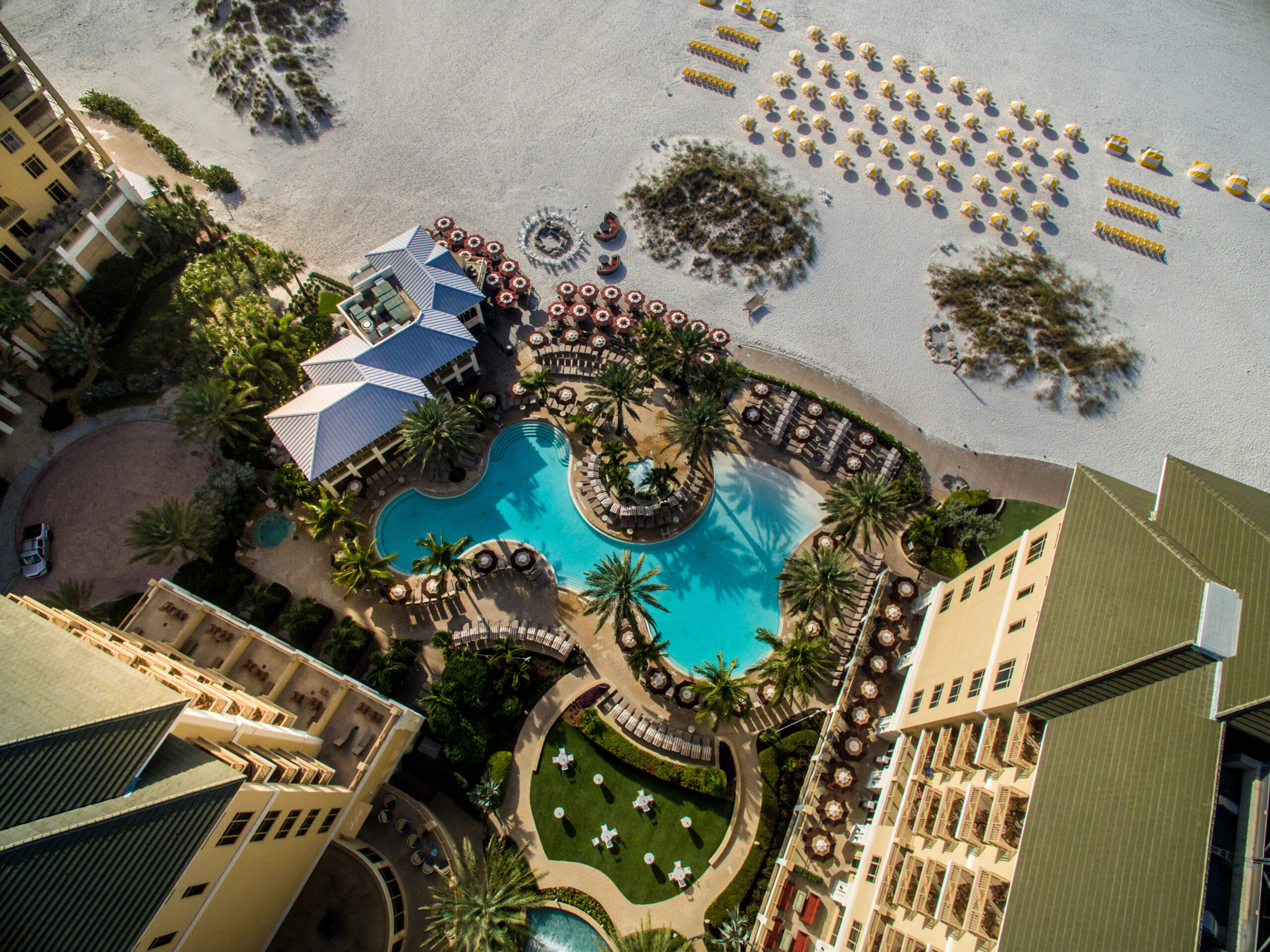 drone shot of the pool and beach at sandpearl