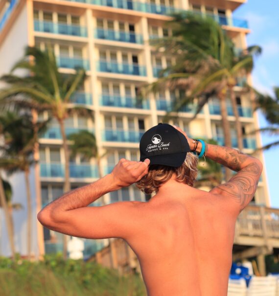 a man looking at jupiter beach resort